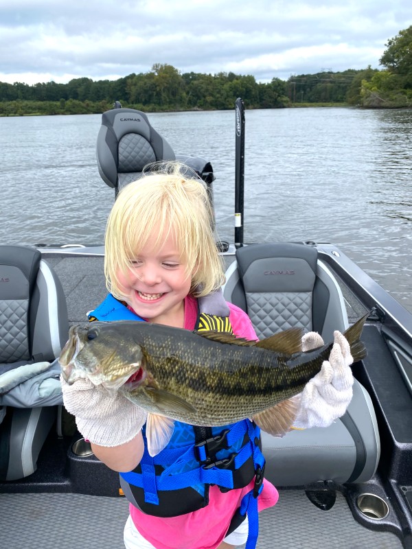 This is Why We Fish! Smiling Young Child Holding Large Bass